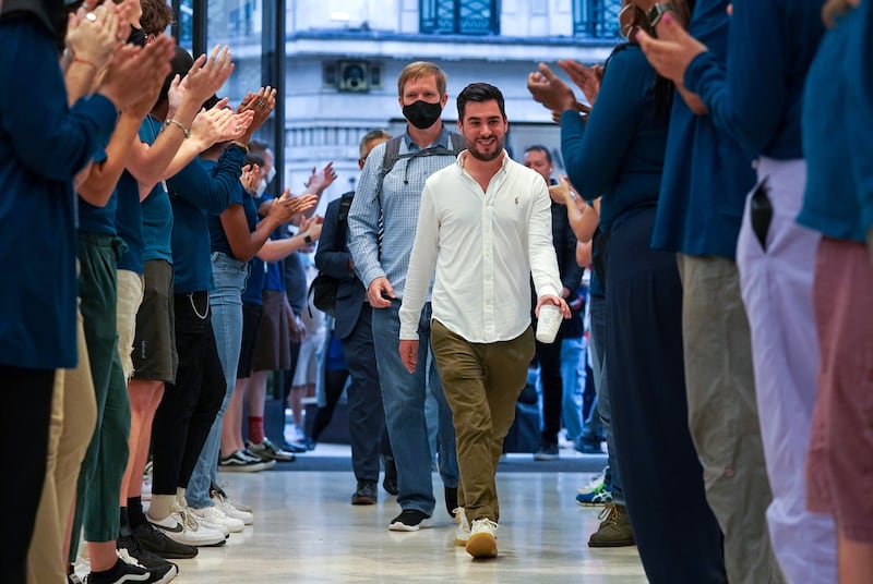 The first customers on Friday to enter the Apple Store in Regent Street, central London, received a round of applause as the new Apple iPhone 13 went on sale in the UK. PA