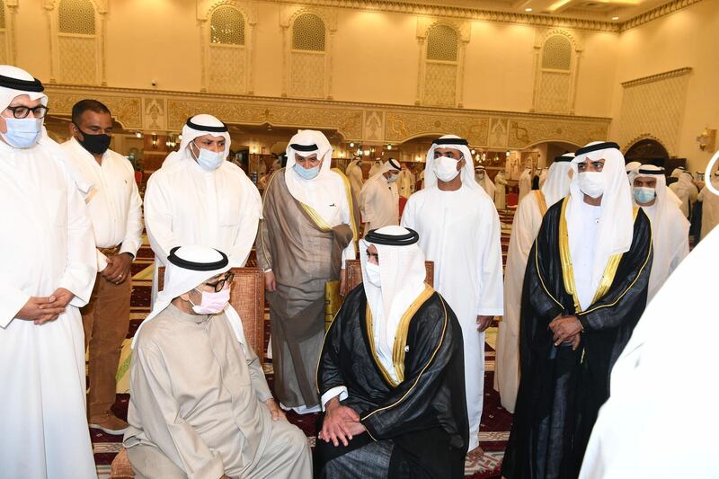 Nasser Sabah Al Sabah, centre left, the son of the late Kuwaiti ruler Sheikh Sabah, receives condolences from Sheikh Saif bin Zayed, UAE's Deputy Prime Minister and Minister of the Interior, centre right, at the Bilal bin Rabah Mosque in Kuwait City. AFP