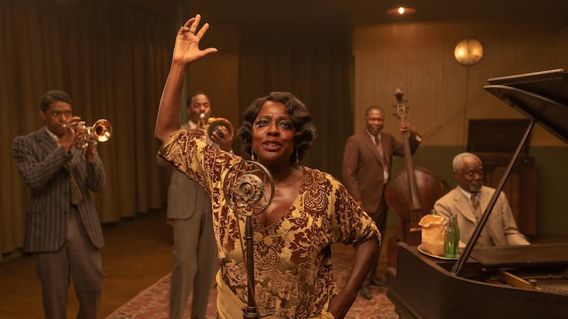 This image released by Netflix shows Chadwick Boseman, from left, Colman Domingo, Viola Davis, Michael Potts and Glynn Turman in "Ma Rainey's Black Bottom." Davis was nominated for a Golden Globe for best actress in a motion picture drama on Wednesday, Feb. 3, 2021 for her role in the film. (David Lee/Netflix via AP)