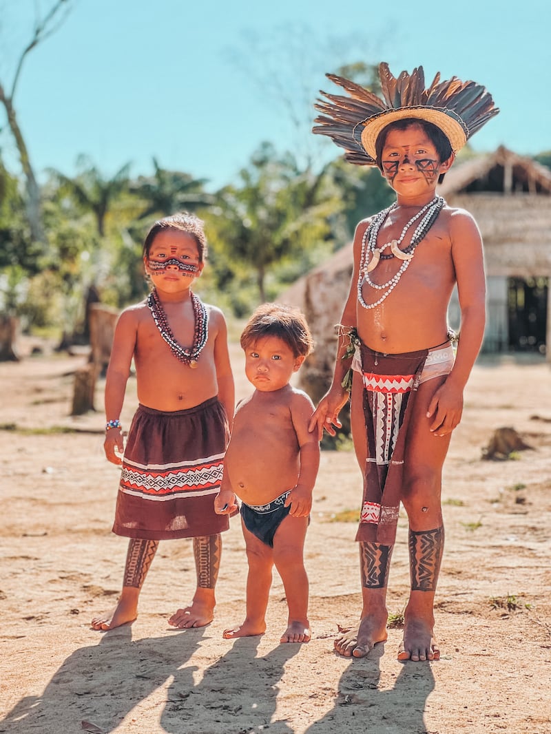 Junior members of the Tuyuka tribe pose solemnly for pictures. Photo: Felipe Gonzalez