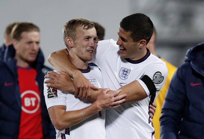 James Ward-Prowse (L) is embraced by England's Connor Coady (R) at the end of the match. EPA