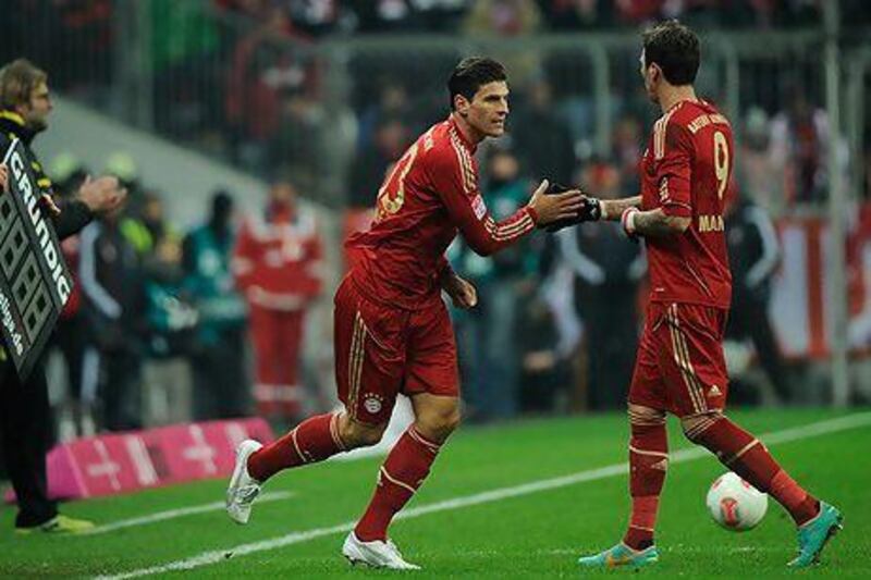 Mario Gomez comes on for Mario Mandzukic, right, the man who has replaced him in Bayern’s starting XI.