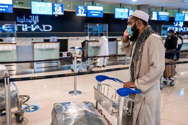 Abu Dhabi, United Arab Emirates, July 8, 2020. Abu Dhabi International Airport Media Tour by Etihad. Passengers at the Etihad Check-In area. Victor Besa / The National Section: NA Reporter: