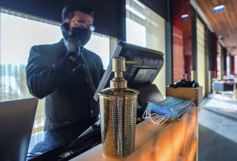 Abu Dhabi, United Arab Emirates, July 4, 2020.   
Sanitisers, gloves and face masks at the reception of 99 Sushi Bar and Restaurant, Four Seasons Hotel, Abu Dhabi.   
Victor Besa  / The National
Section:  NA 
Reporter: