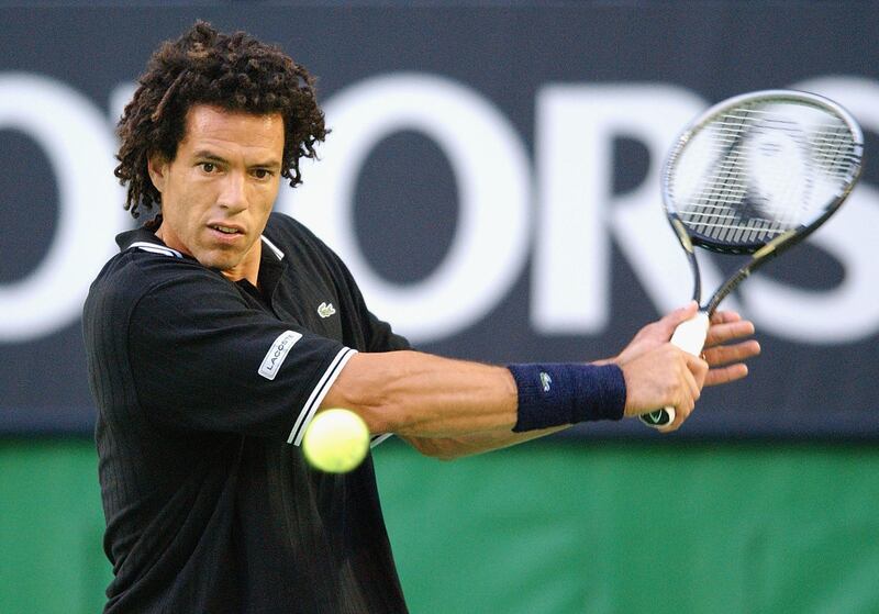 MELBOURNE - JANUARY 22:  Younes El Aynaoui of Morocco in action against Andy Roddick of the USA  during the Australian Open Tennis Championships at Melbourne Park in Melbourne, Australia on January 22, 2003. (Photo by Nick Laham/Getty Images).