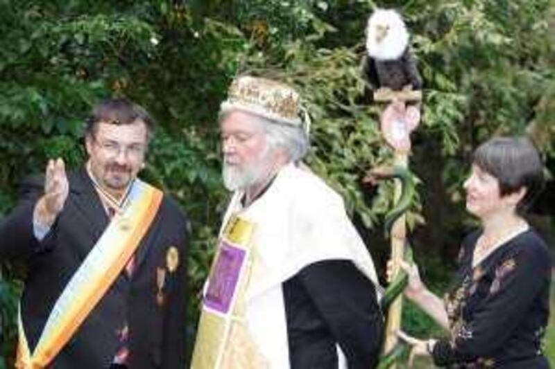 Self-proclaimed His Imperial Majesty George II of the Empire of Atlantium, left, self-proclaimed Prince Paul Delprat of the Principality of Wy, center, and his self-proclaimed princess Susan chat during a break from  Australia's first conference of micronation leaders on Dangar Island, 60km north of Sydney, Australia, Saturday, April 17, 2010. Micronations are communities created by people who secede from their countries in order to start their own. (AP Photo/Rob Griffith) *** Local Caption ***  XRG101_Australia_Micronations.jpg