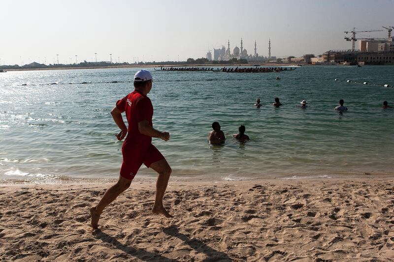 October 9, 2010, Abu Dhabi, UAE: 

A spectator runs along the Shangrila's beach to follow a race.

Lee Hoagland/ The National