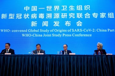 Members of the WHO team investigating the origins of the coronavirus join Liang Wannian, the head of a panel on coronavirus response at China's National Health Commission, at a news conference in Wuhan, central China. Reuters
