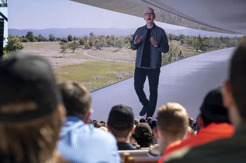 Tim Cook, chief executive of Apple, is displayed on a screen speaking during the Apple Worldwide Developers Conference. Bloomberg