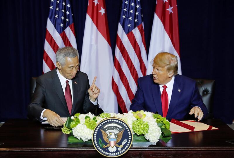 Singapore's Prime Minister Lee Hsien Loong speaks with U.S. President Donald Trump as the sign a memorandum of defense prior to their bilateral meeting on the sidelines of the annual United Nations General Assembly in New York City, New York, U.S., September 23, 2019. REUTERS/Jonathan Ernst