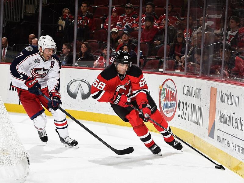 Jaromir Jagr, right, of the New Jersey Devils skates with the puck as Jack Johnson of the Columbus Blue Jackets defends during their game at the Prudential Center on November 1, 2014 in Newark, New Jersey.  Al Bello/Getty Images