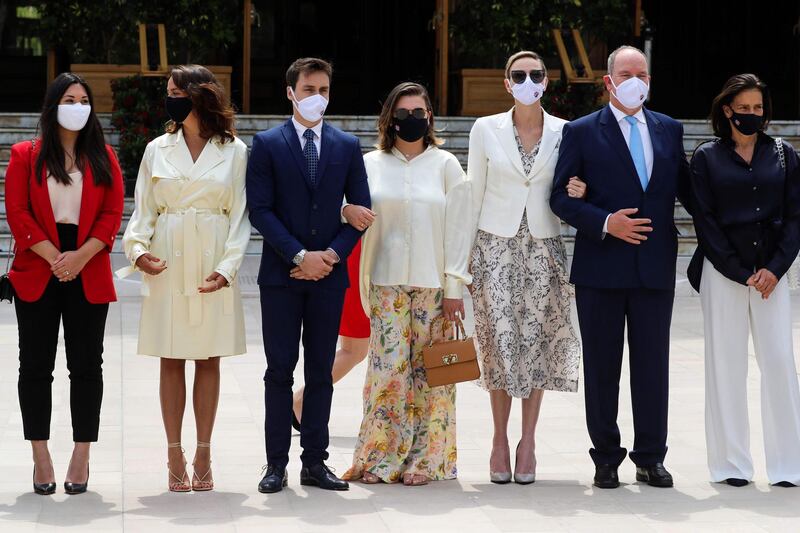 Marie Chevallier, Pauline Ducruet, Louis Ducruet, Camille Gottlieb, Princess Charlene of Monaco, Prince's Albert II of Monaco and Princess Stephanie, all wearing a protective facemask, attend the inauguration ceremony of the new Casino place, in Monaco as the Principality eases lockdown measures taken to curb the spread of the COVID-19 (the novel coronavirus).    AFP