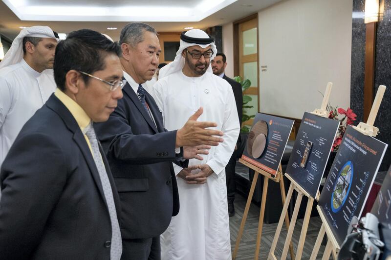 SINGAPORE, SINGAPORE - February 28, 2019: HH Sheikh Mohamed bin Zayed Al Nahyan, Crown Prince of Abu Dhabi and Deputy Supreme Commander of the UAE Armed Forces (R) looks at project during a visit to Mubadala's GLOBALFOUNDRIES semiconductor facility. Seen with Kay Chai Ang, Senior Vice President and General Manager for GlobalFoundries Asia and Europe Operations (2nd L), HE Dr Mohamed Maliki bin Osman, Senior Minister of State, Ministry of Defence & Ministry of Foreign Affairs (L) and HE Khaldoon Khalifa Al Mubarak, CEO and Managing Director Mubadala, Chairman of the Abu Dhabi Executive Affairs Authority and Abu Dhabi Executive Council Member (back L).
( Ryan Carter for the Ministry of Presidential Affairs )
---
