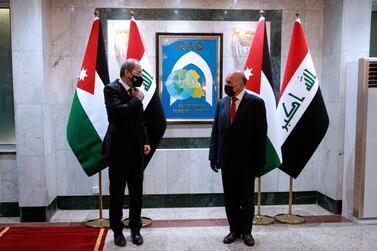 Iraqi Foreign Minister Fuad Hussein met Jordanian counterpart Ayman Safadi  in Baghdad on Wednesday. AP