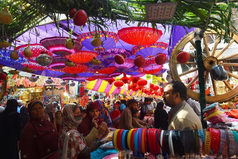 Pakistani shoppers throng a decorated market ahead of Eid-e-Milad-un-Nabi, the birthday of Prophet Mohammad, in Lahore. AFP