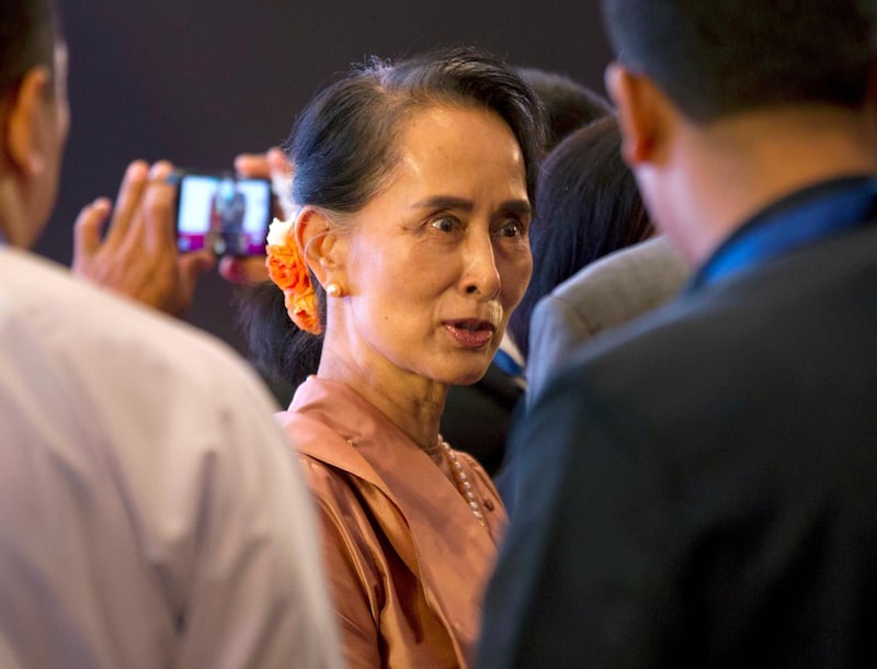 Myanmar State Counsellor Aung San Suu Kyi greets attendees during the 3rd Asia-Pacific Water Summit at a hotel in Yangon, Myanmar, Monday, Dec. 11, 2017.  (AP Photo/Thein Zaw)