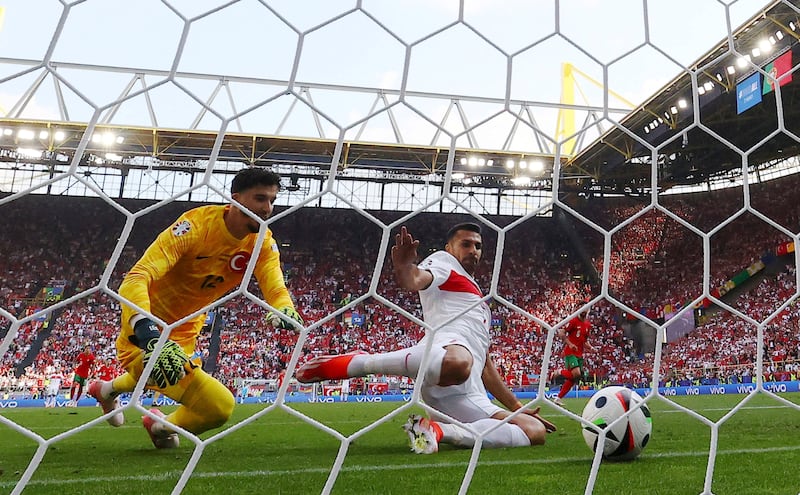Turkey's Samet Akaydin scores an own goal. Reuters