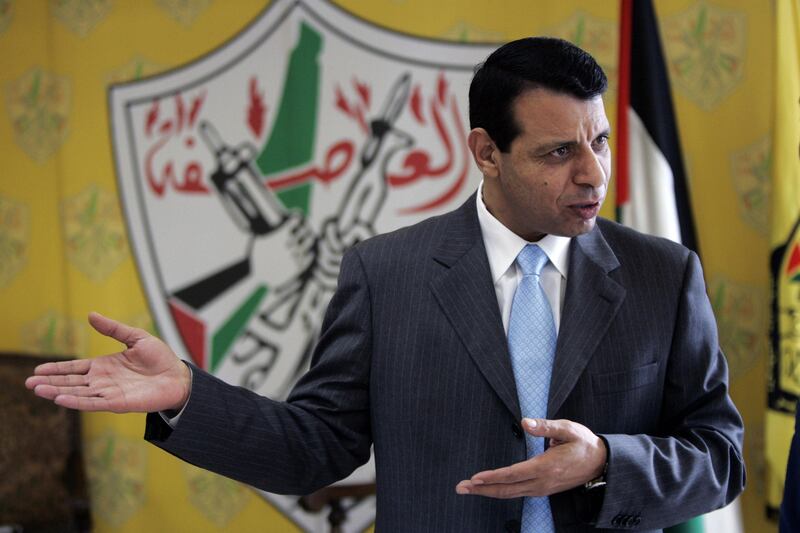 File - In this Jan. 3, 2011 file photo, then Palestinian Fatah leader Mohammed Dahlan gestures as he speaks during an interview with The Associated Press in his office in the West Bank city of Ramallah. The exiled Palestinian politician who quietly negotiated a power-sharing deal for Gaza with former arch foe Hamas discussed the details for the first time in an interview, saying he expects the understandings to lead to a swift opening of the blockaded territory's border with Egypt and ease crippling power shortages. (AP Photo/Majdi Mohammed, File)