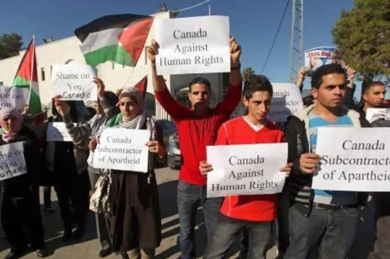 Palestinian activists protest in Ramallah against Canadian prime minister Stephen Harper’s statement urging them to drop their bid for upgraded UN status.