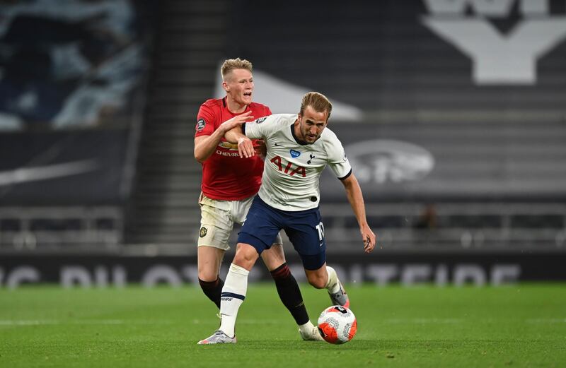 Scott McTominay tackles Harry Kane during the Premier League match between Tottenham Hotspur and Manchester United. AP Photo