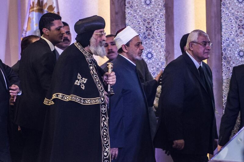 From left: Pope Tawadros II of Alexandria, leader of Egypt’s Coptic Church, Sheikh Ahmed Al Tayeb, Grand Imam of Al Azhar, and Egypt’s former interim president, Adly Mansour. Khaled Desouki / AFP