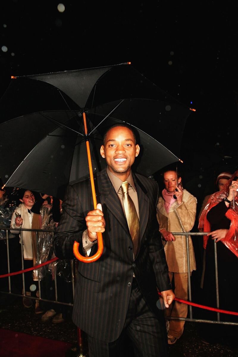 SYDNEY, AUSTRALIA- JULY 19:  Actor Will Smith walks the red carpet under heavy rain at the premiere of "I,Robot" at Fox Studios July 19, 2004 in Sydney, Australia. (Photo by Patrick Riviere/Getty Images)