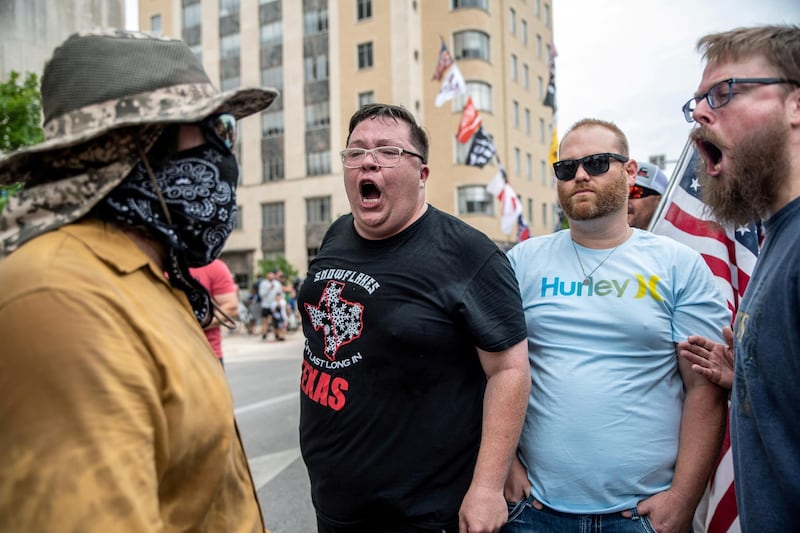 People protest against mandates to wear masks in Austin, Texas. Reuters