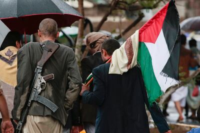 Houthi supporters carry a Palestinian flag in Sanaa, Yemen. AP