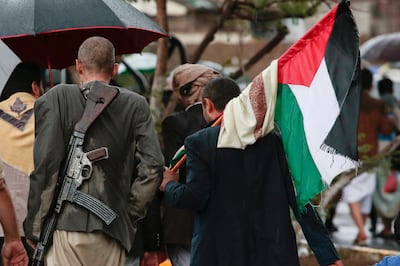 Houthi supporters carry a Palestinian flag in Sanaa, Yemen. AP