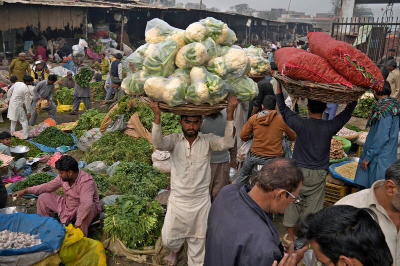 A market in Lahore, Pakistan. Debt levels among low-income countries have soared since central banks lifted interest rates in response to rising inflation. AP