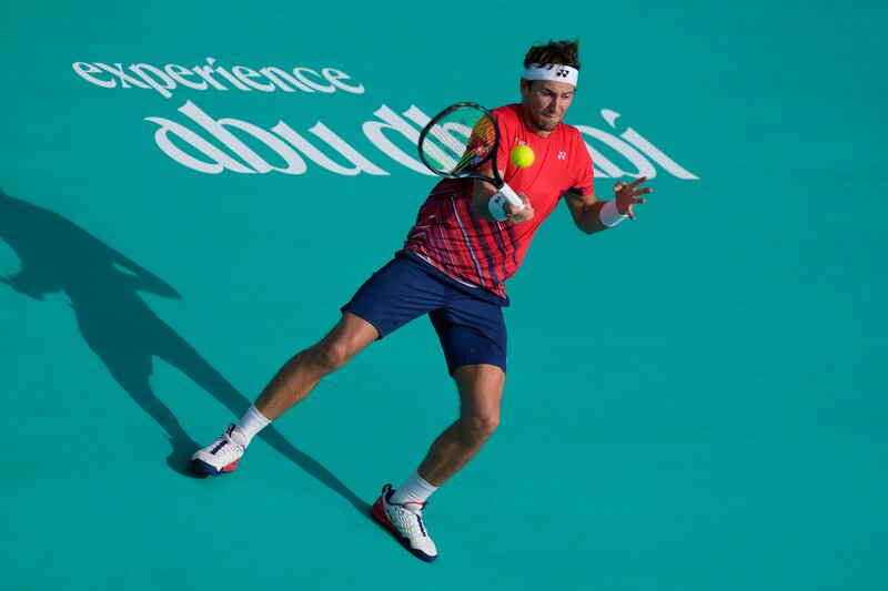 Casper Ruud hits a forehand to Carlos Alcaraz. AP