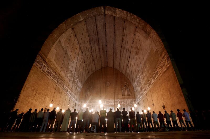 Egyptian Muslims perform evening prayers called 'Tarawih' inside Al Sultan Hassan mosque during the Muslim holy fasting month of Ramadan in the old Islamic area of Cairo, Egypt. Amr Abdallah Dalsh / Reuters