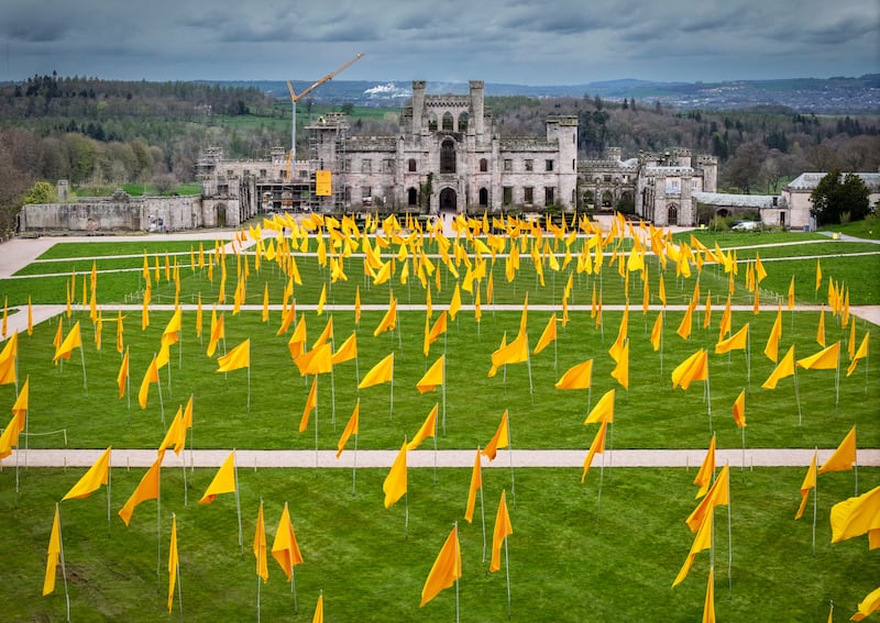 Volunteers hoist more than 500 yellow flags at Lowther Castle in the Lake District, part of a project by a local artist. Getty Images