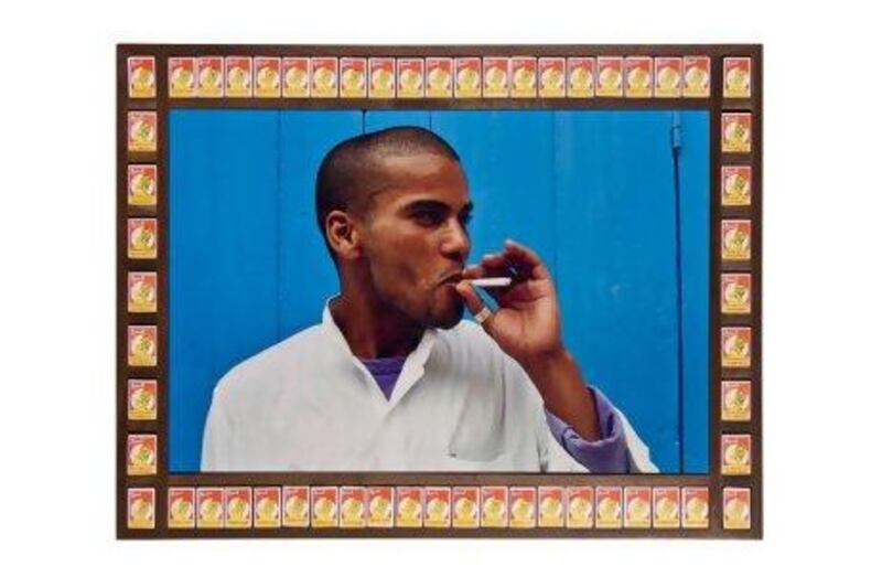 'Blue Boy' by the Moroccan artist Hassan Hajjaj is one of the works displayed at the Third Line gallery. It riffs on constructed notions of what is anti-social behaviour, juxtaposed with found cigarette boxes sold - and therefore sanctioned - by the State. Courtesy of Hassan Hajjaj / Third Line Gallery