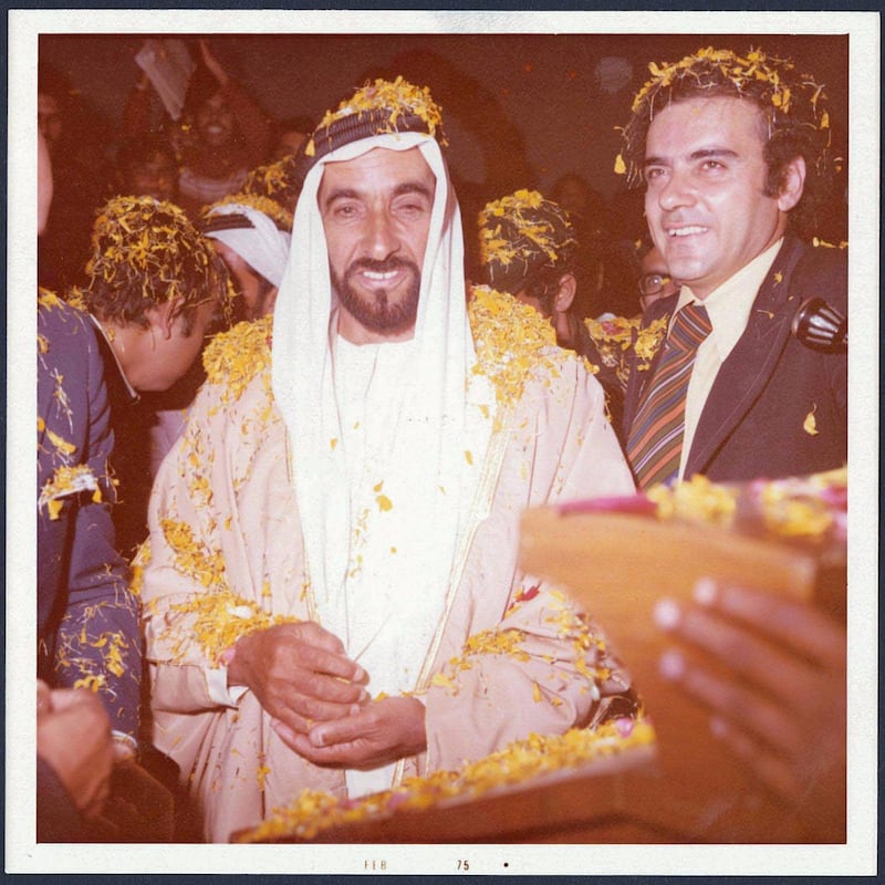 Sheikh Zayed and Zaki Nusseibeh covered in flower petals during a trip to India, 1975. Copyright Zaki Nusseibeh. Courtesy of the Akkasah Center for Photography
