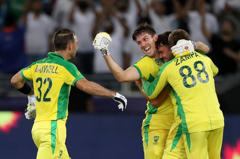Australia's Glenn Maxwell, left, celebrates hitting a four to win the Twenty20 World Cup final against New Zealand in Dubai. AP