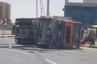 A woman and child were killed after a cement mixer overturned and landed on top of their vehicle. Abu Dhabi Police