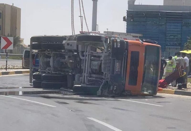 A woman and child were killed after a cement mixer overturned and landed on top of their vehicle. Abu Dhabi Police