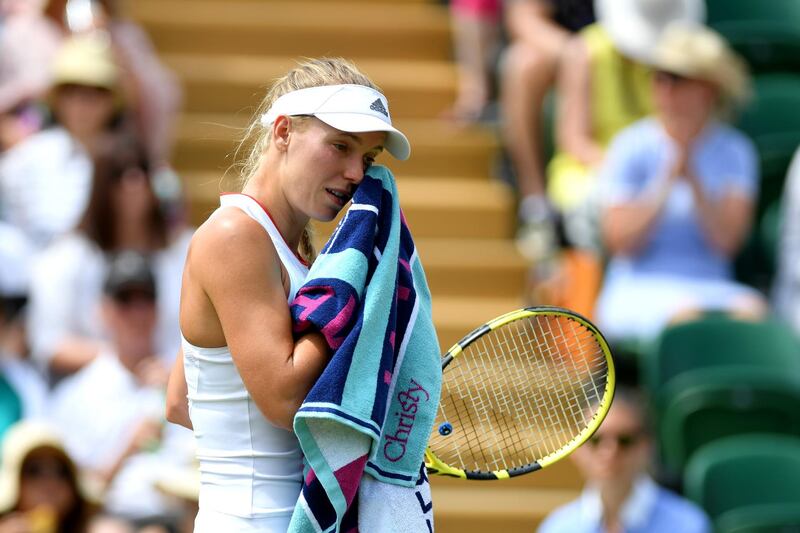 LONDON, ENGLAND - JULY 05: Caroline Wozniacki of Denmark reacts in her Ladies' Singles Third round match against Shuai Zhang of China during Day five of The Championships - Wimbledon 2019 at All England Lawn Tennis and Croquet Club on July 05, 2019 in London, England. (Photo by Mike Hewitt/Getty Images)