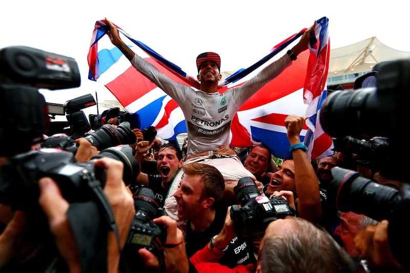 Hamilton celebrates winning the F1 world title after the US Grand Prix at the Circuit of the Americas. Getty Images 
