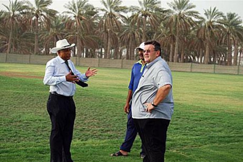 Andy Atkinson, in charge of the pitches for the ICC, right, inspects the facilities at Al Dhaid Cricket Village.