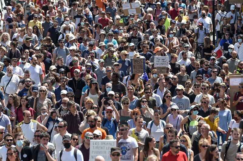 Large crowds gather as they demonstrate against new coronavirus safety measures in Nantes, western France.