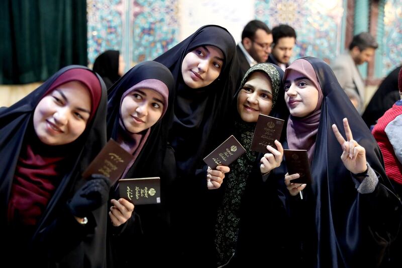 Voters pose for a selfie during the parliamentary elections at a polling station in Tehran, Iran. Iranians began voting for a new parliament on Friday, with turnout seen as a key measure of support for Iran's leadership as sanctions weigh on the economy and isolate the country diplomatically. AP Photo