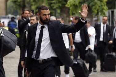 Real Madrid's striker Karim Benzema greets the fans as he arrives at the club's hotel in Chantilly, north of Paris, France, 26 May 2022.  Paris will hosts the UEFA Champions League final soccer match between Liverpool FC and Real Madrid at the Stade de France in Saint-Denis (Paris) on 28 May 2022.   EPA / CHRISTOPHE PETIT TESSON