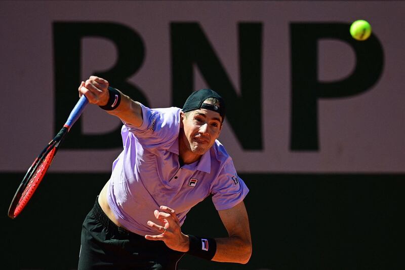 United States' John Isner serving during his victory over Sam Querrey. AFP