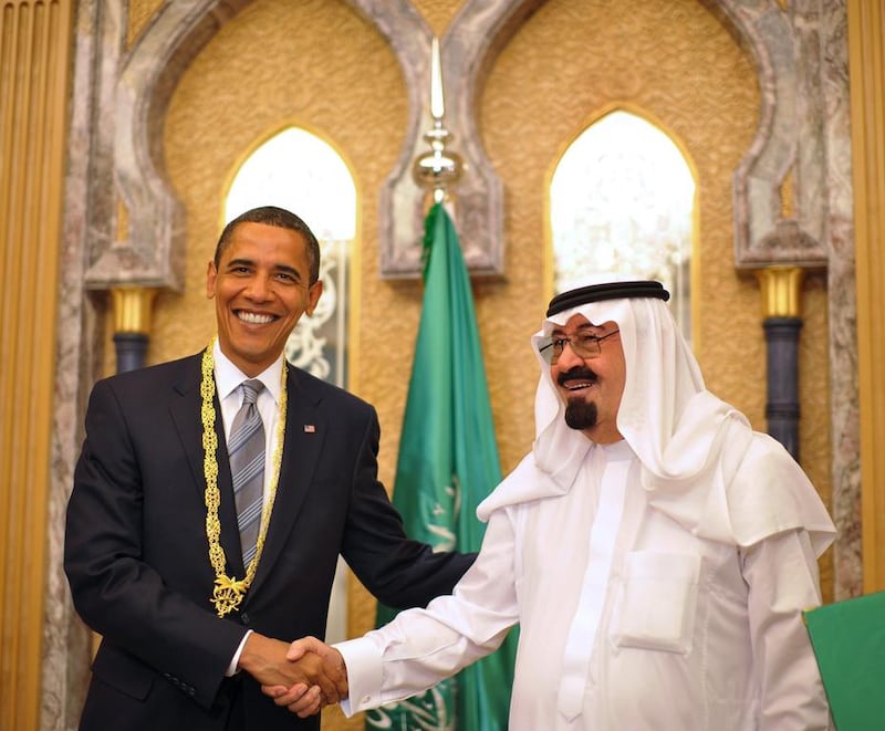 US President Barack Obama shakes hands with King Abdullah after Obama was presented with the King Abdul Aziz Order of Merit. Mandel Ngan / AFP Photo