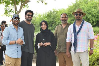 Twofourfiftyfour's H.E. Maryam Eid AlMheiri with the film's producers Pramod Uppalapati and Vamsi Krishna Reddy, as well as Prabhas and the film's director Sujeeth Reddy. Supplied