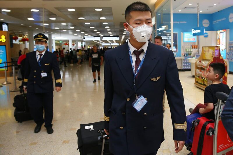 Flight crew arrive at Sydney International Airport. Getty Images