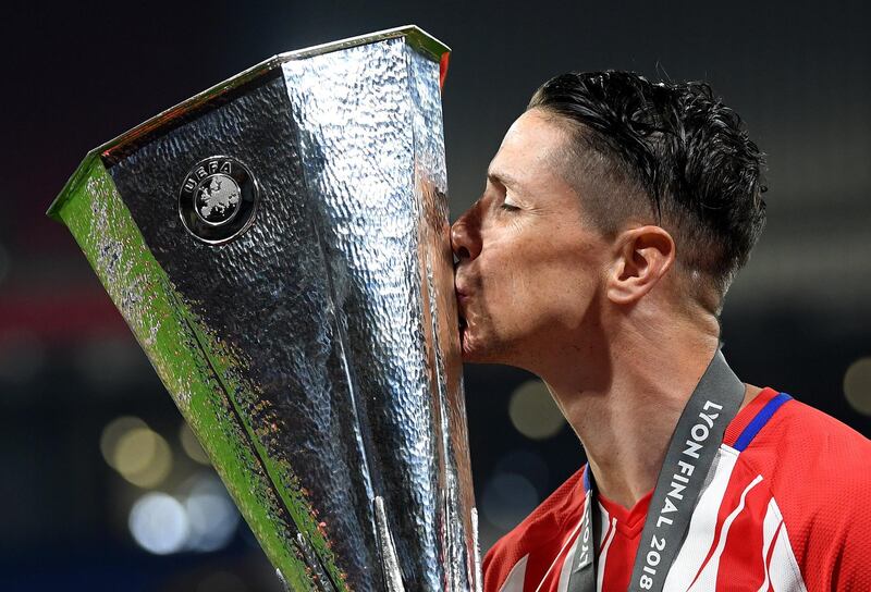 Fernando Torres of Atletico Madrid celebrates with the trophy after winning the UEFA Europa League Final between Olympique de Marseille and Club Atletico de Madrid at Stade de Lyon in Lyon, France, on May 16, 2018.  Matthias Hangst / Getty Images