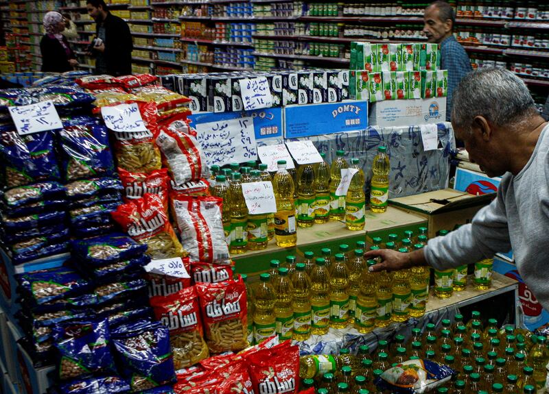 Egyptian shoppers buy subsidised food at a consumer association market in Cairo. Reuters